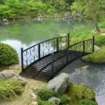 7' Metal Arch Garden Bridge Arc Footbridge with Side Railings Decorative Scrollwork, Black - Image 11