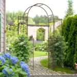 7' Metal Garden Arbor, Garden Arch with Gate, Fleur De Lis Motif, Latching Doors, Planter Shelves for Climbing Vines, Ceremony, Weddings, Party, Garden, Backyard, Lawn, Brown - Image 10